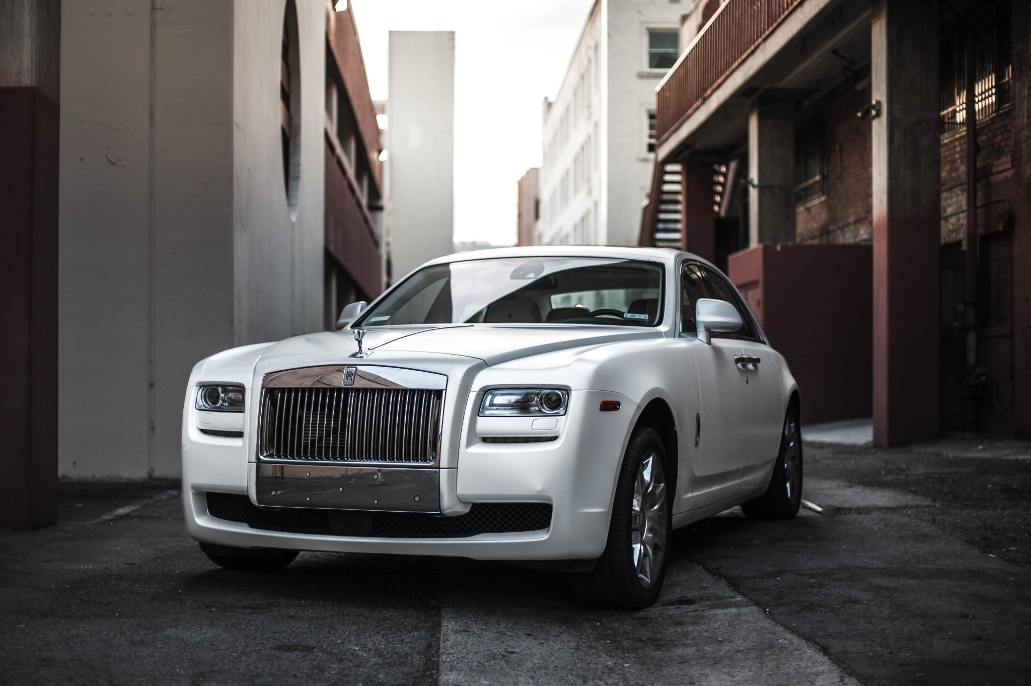 White Rolls-Royce saloon photographed in an urban setting
