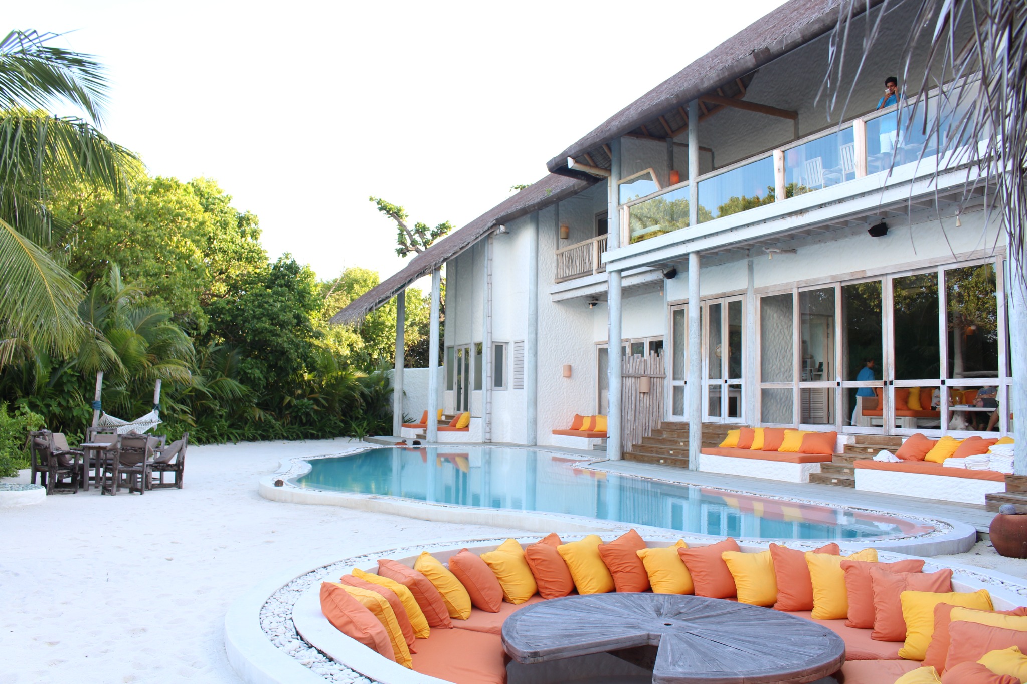 Private villa with pool, sandy terrace and tropical greenery at Soneva Fushi
