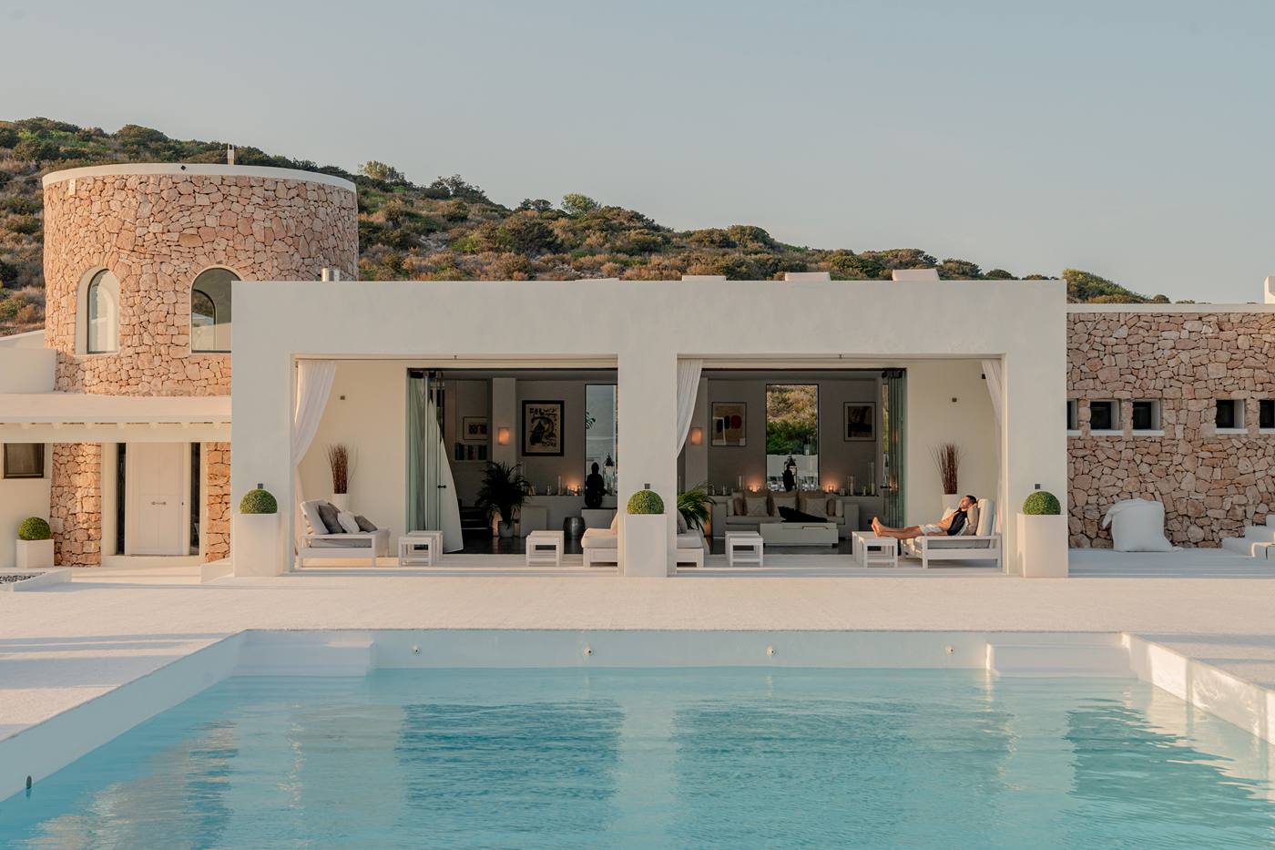 The white stone villa and pool on Tagomago island in daylight
